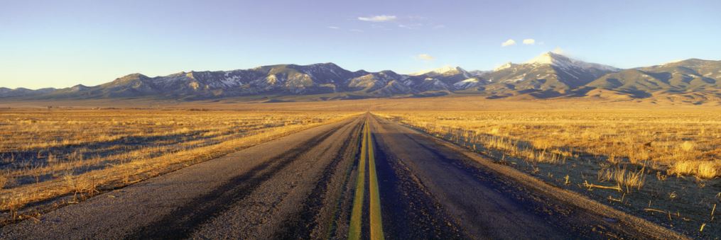 Highway leading toward mountains in the Great Basin